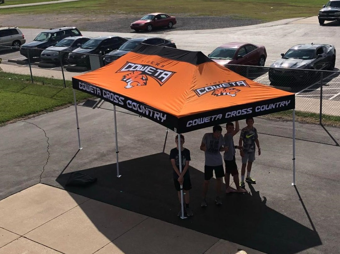 Orange Coweta Cross Country 10 x 20 high school canopy sheltering athletes