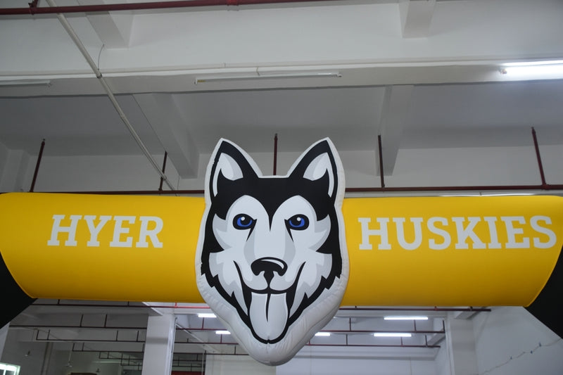 custom shaped Inflatable arch with 'HYER HUSKIES' text and a mascot illustration of a Husky dog's face