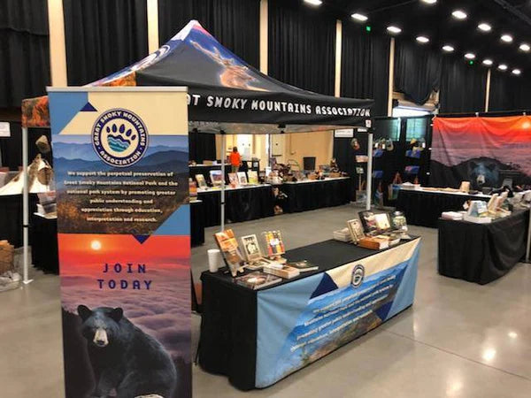 Trade show booth with a custom-printed canopy tent featuring Great Smoky Mountains Association branding