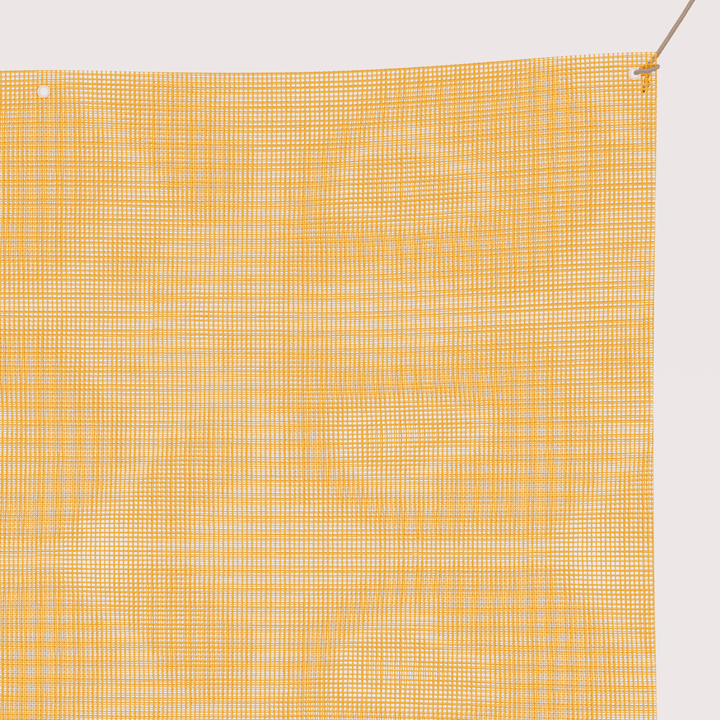 close up view of mesh vinyl banner showing grommets