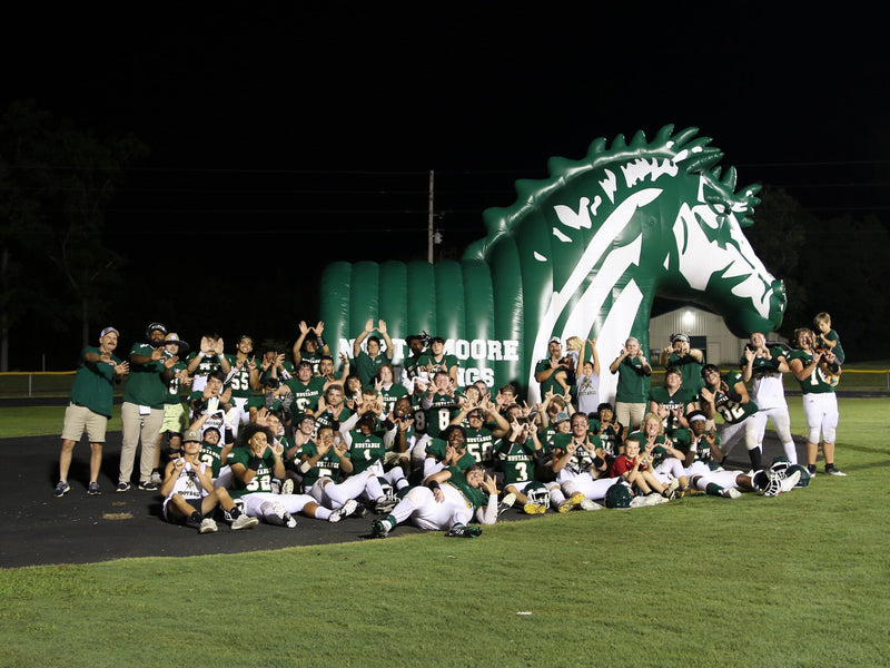 north moore high school mascot inflatable tunnels with full team infront