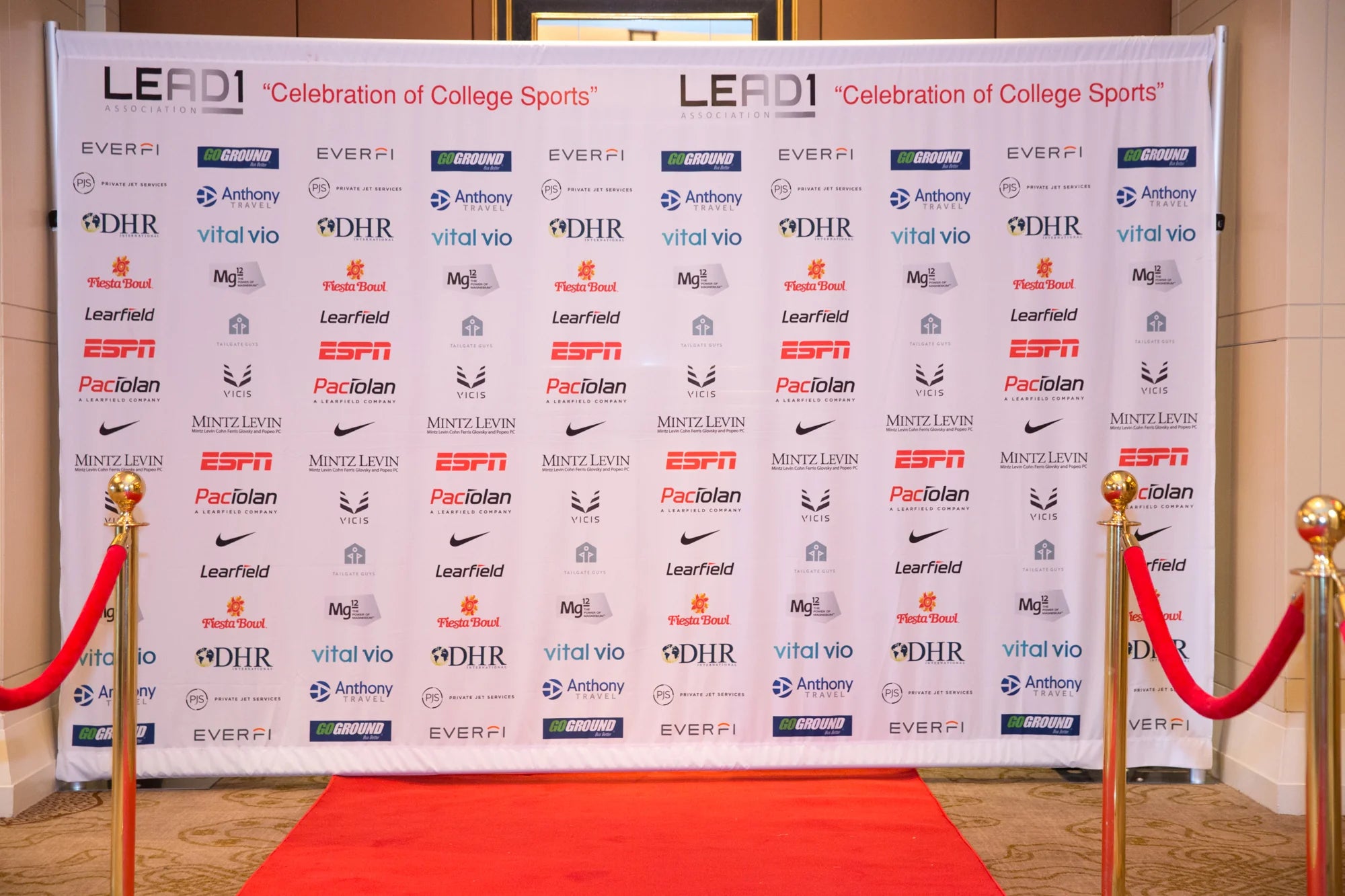 Red carpet exhibit backdrop with LEAD1 Association and sponsor logos