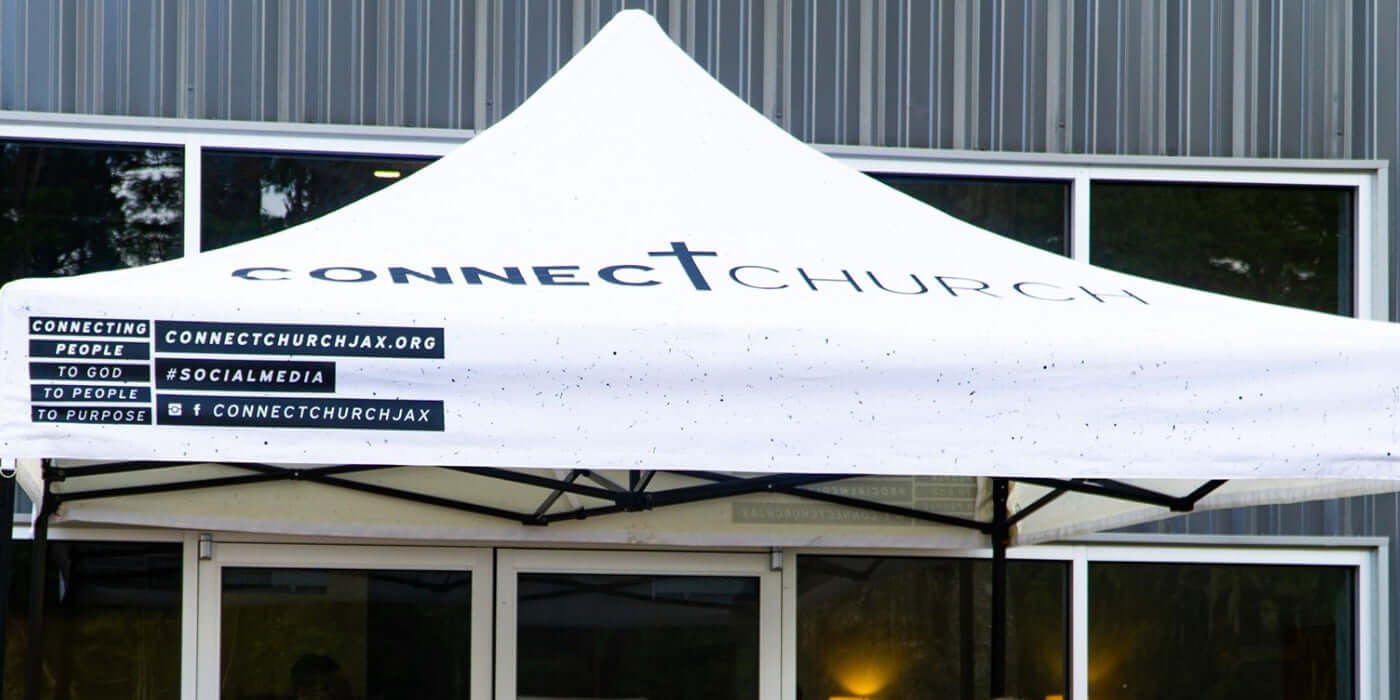 Branded 10x10 pop-up tent for Connect Church set up outside main entrance, showcasing custom logo and church mission messaging
