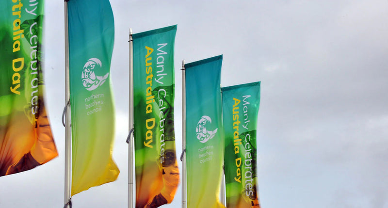 Colorful vertical banner flags celebrating Australia Day with vibrant graphics on display