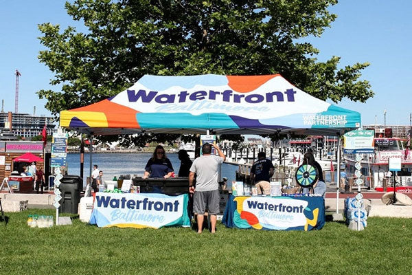 10x20 custom canopy branded with Waterfront Partnership of Baltimore's brand logo