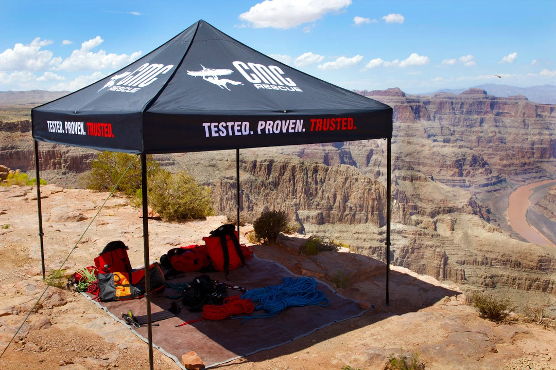 pop up canopy tent with pole frames, customized for a rock climbing brand, in majestic canyon