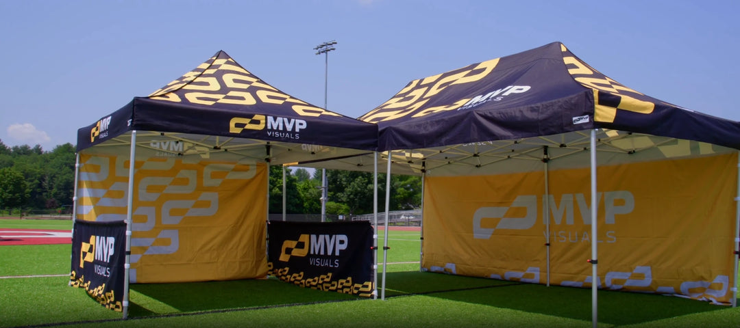10x10 and 10x20 canopy tents side by side in outdoor stadium