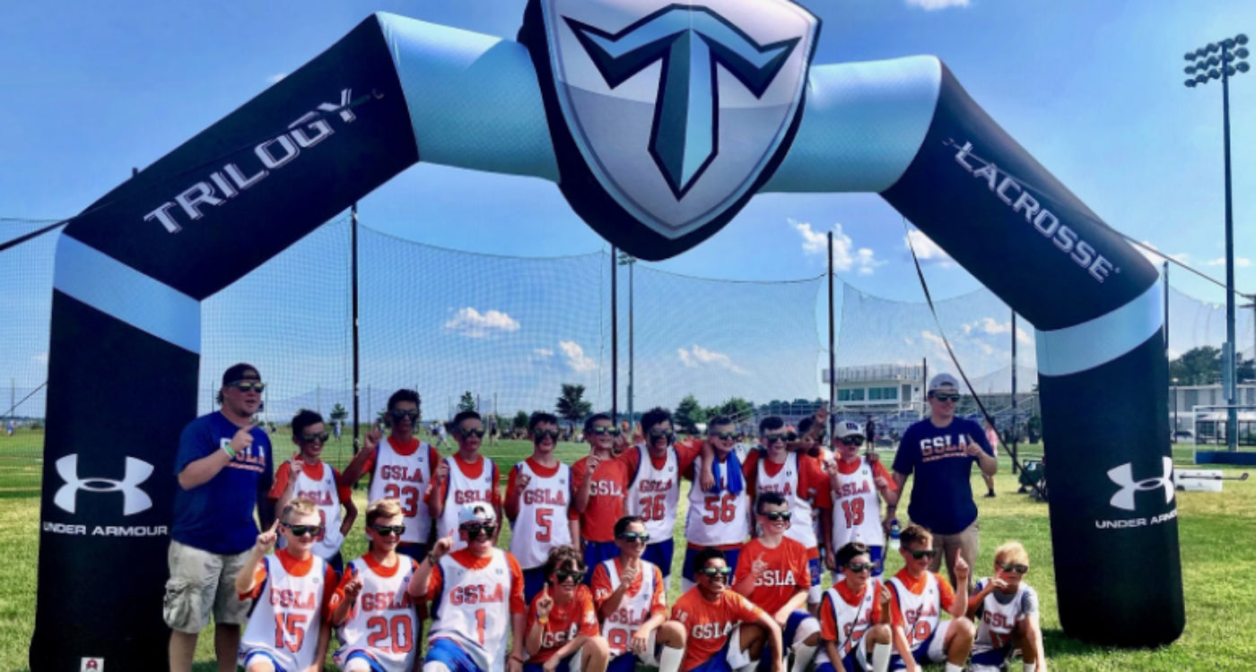 athletes under Trilogy Lacrosse Custom Inflatable Arch