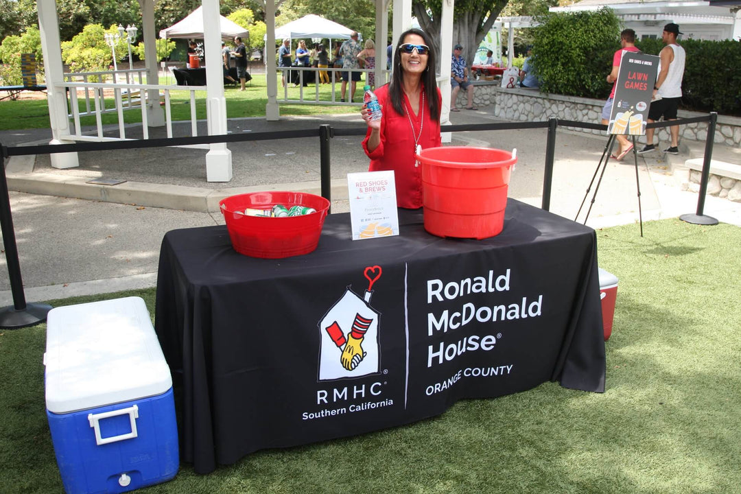 ronald mcdonald house booth with black branded table cover