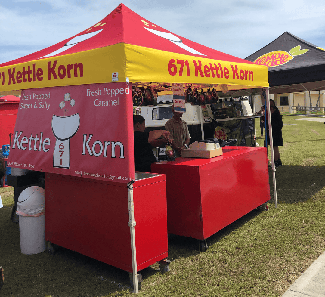 671 Kettle Korn custom canopy tent at outdoor festival with popcorn stand and vendor booth setup