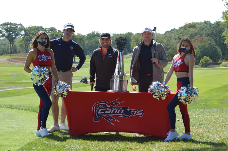 Stretch table cover with Boston Cannons logo on a golf course