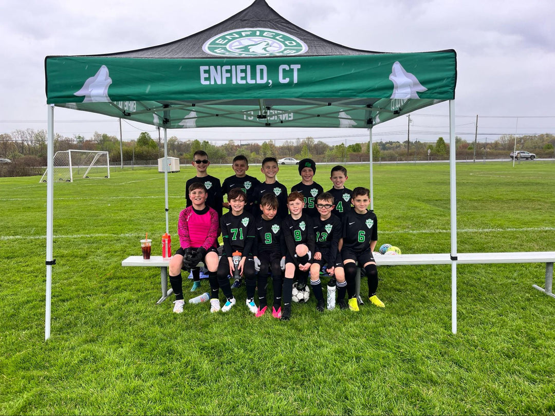 Youth soccer team under a green Enfield, CT school canopy