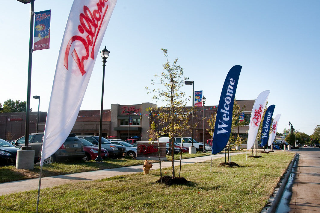 Feather flags used for promotional advertising outside a Dillons shopping complex
