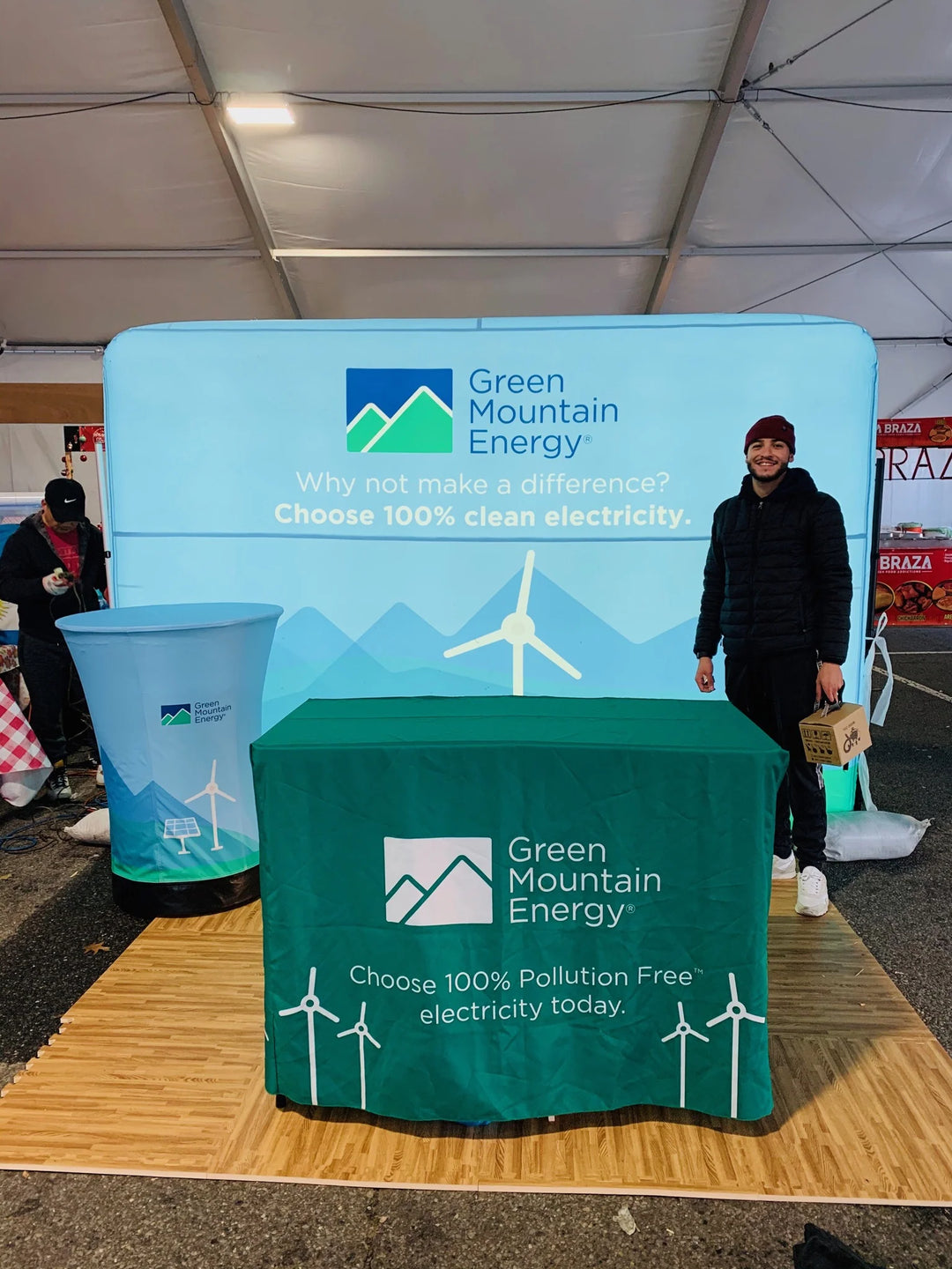 Trade show booth with custom inflatable logo backdrop for Green Mountain Energy