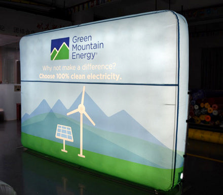 Backlit inflatable logo wall for Green Mountain Energy, promoting clean electricity