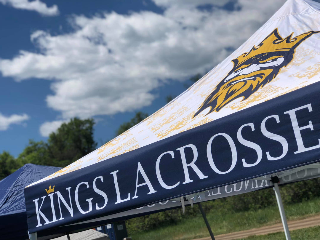 sports team tent with kings lacrosse logo on the peak of the canopy