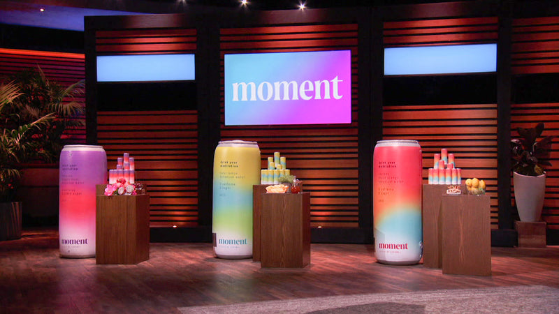 three inflatable beverage cans customized for moment during a shark show recording
