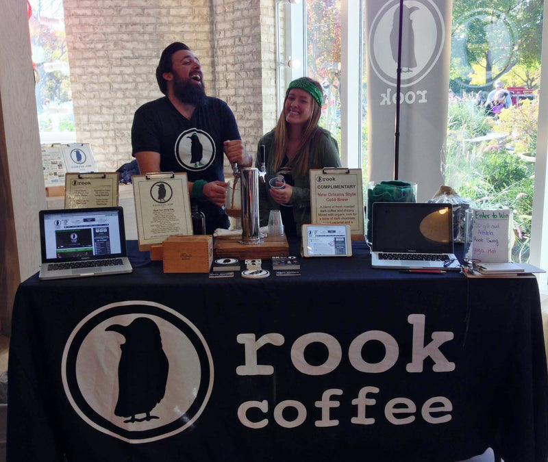 Custom table runner with Rook Coffee logo at an engaging company event
