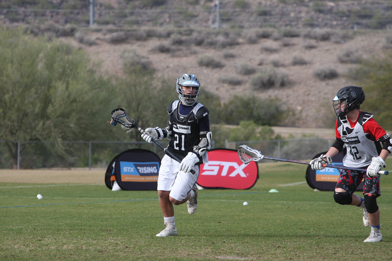 stx rising lacrosse sporting event in session with two horizontal pop out banners in the background