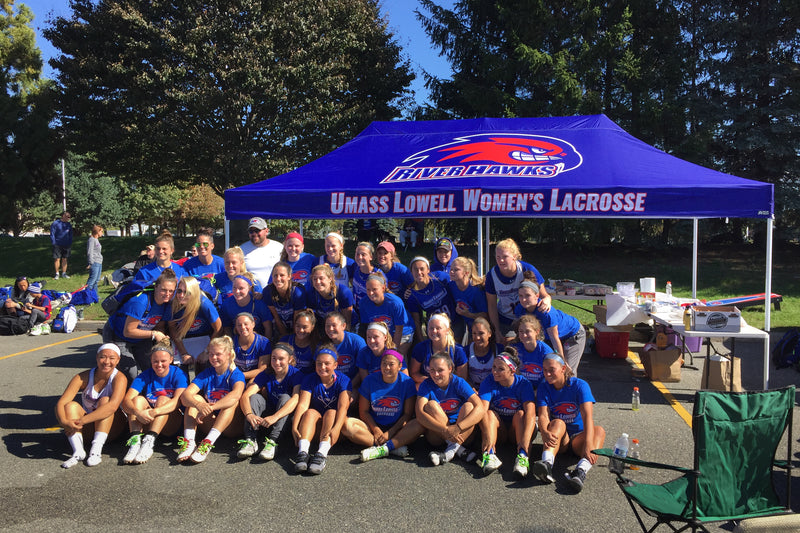 UMASS LOWELL WOMENS LACROSSE branded 10x20 canopy tent with full team members in front