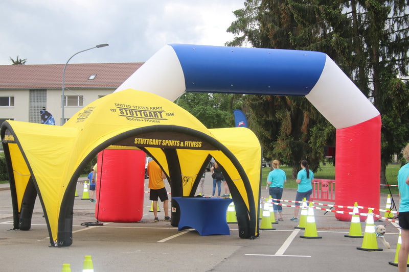 yellow inflatable dome tent customized for stuttgart sports and fitness during a sporting event