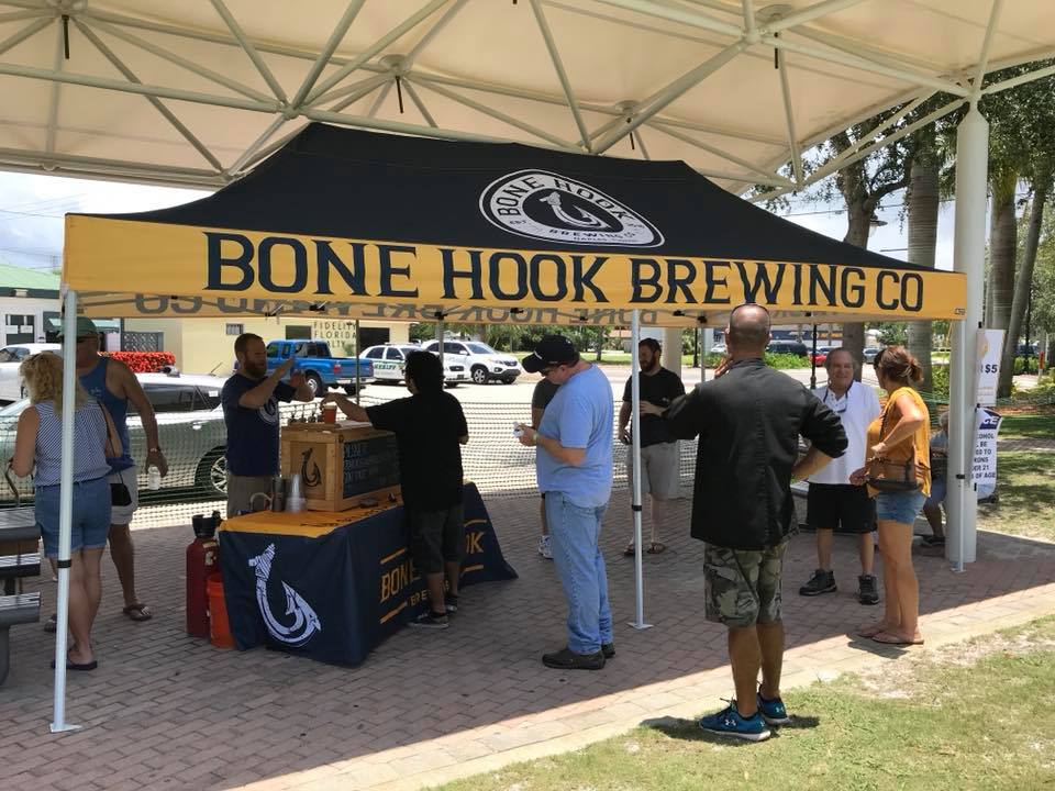 Custom 10x20 canopy tent with Bone Hook Brewing Co branding at outdoor tasting event