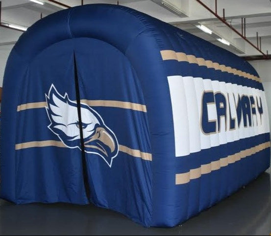 Navy blue and white inflatable tunnel with eagle mascot and CALVARY lettering for school athletics or team entrances