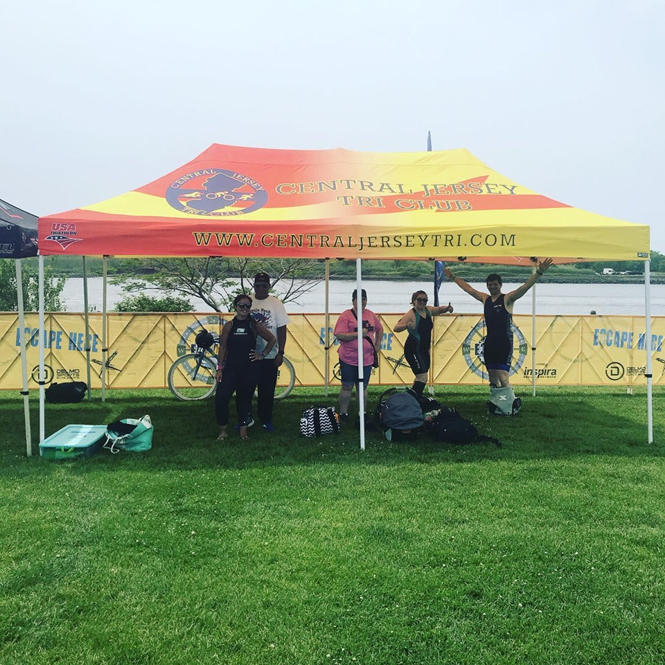 Central Jersey Tri Club custom 10x20 canopy tent with red and yellow design at outdoor race event