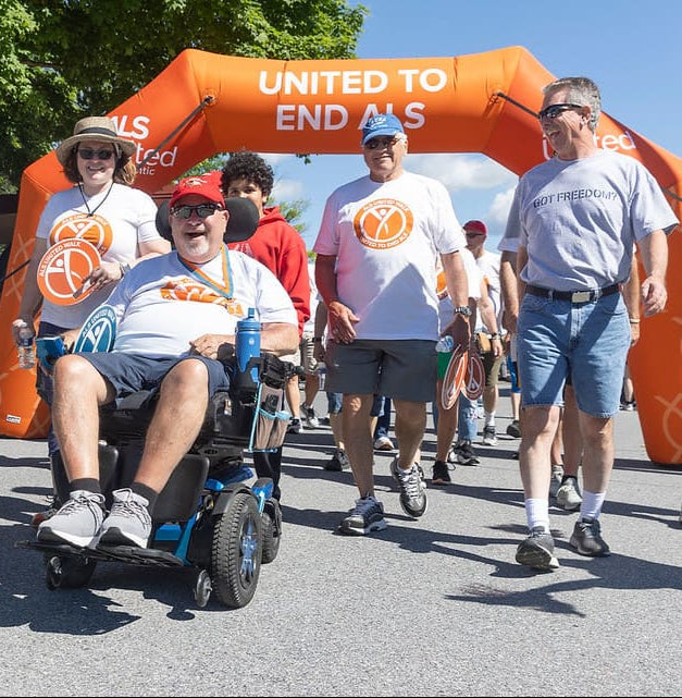 Custom inflatable arch at ALS awareness walk with participants.