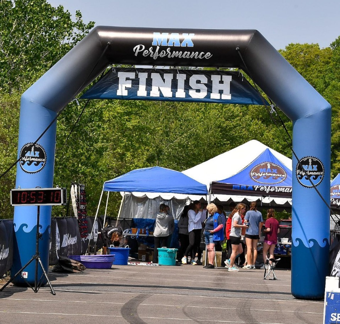 Custom inflatable finish line arch for Max Performance event with blue and black gradient design