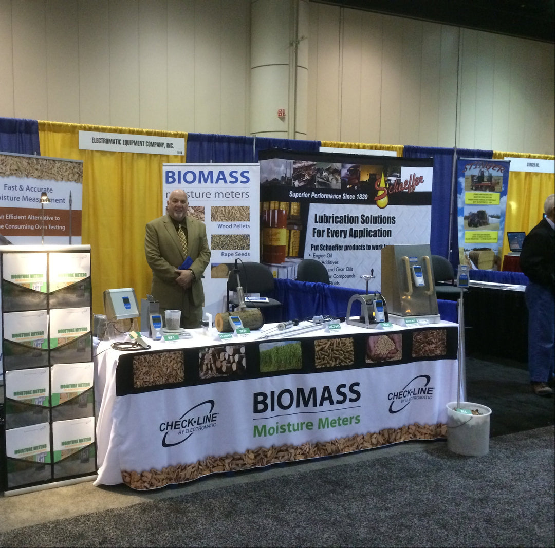 Custom printed table cover for Checkline Biomass Moisture Meters at trade show booth with product display