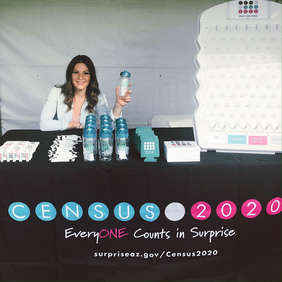 Custom table cover for City of Surprise Census 2020 outreach booth with promotional giveaway items and plinko game