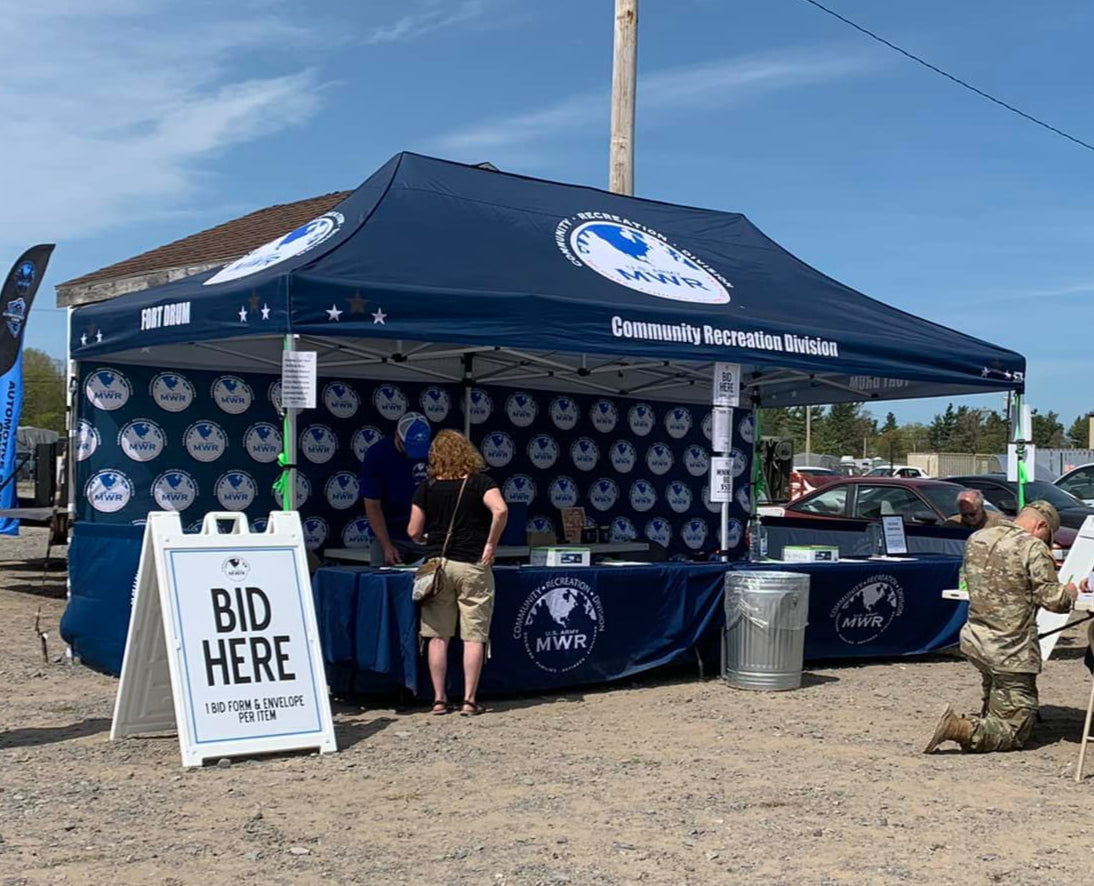 Fort Drum MWR 10x20 canopy tent set up for community recreation auction event with bidding station