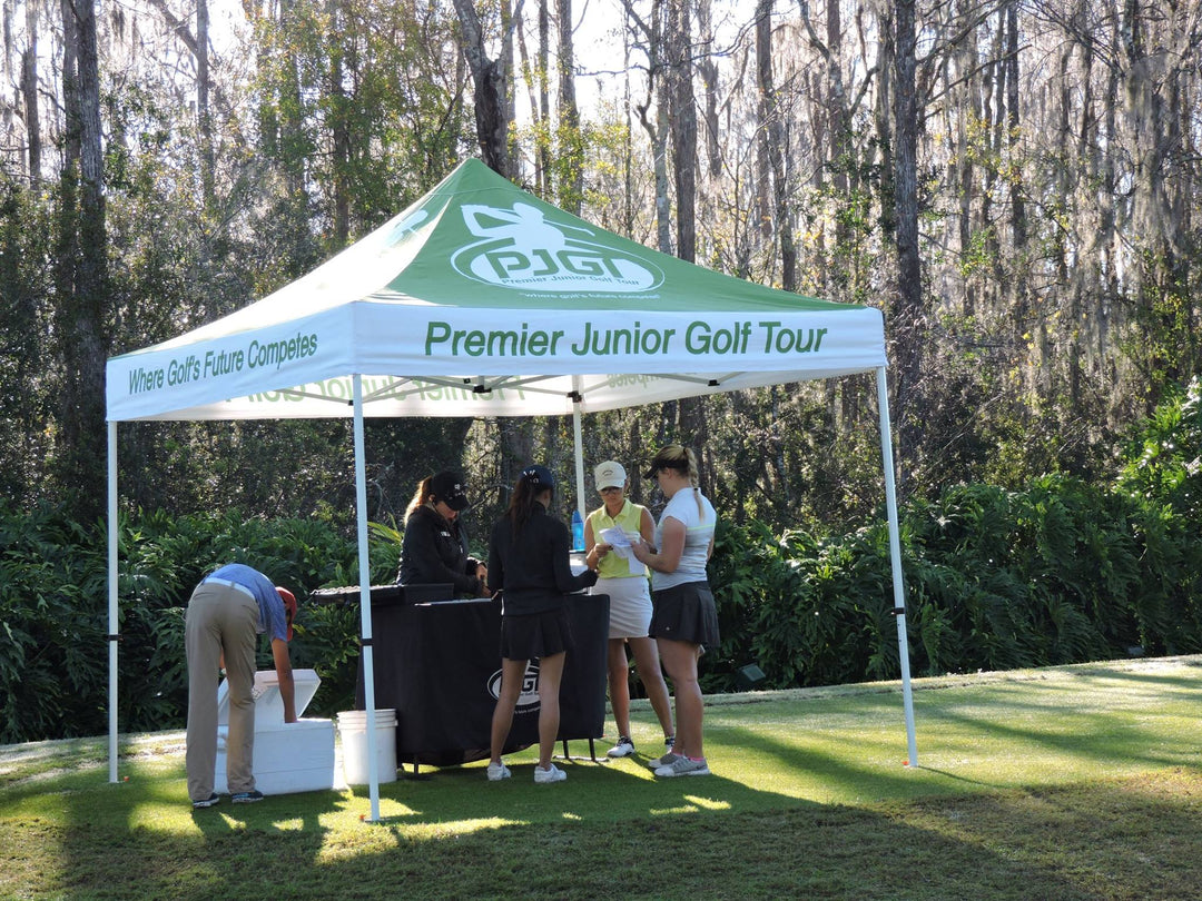 outdoor sports canopy tent acting as a registration booth for premier junior golf tour
