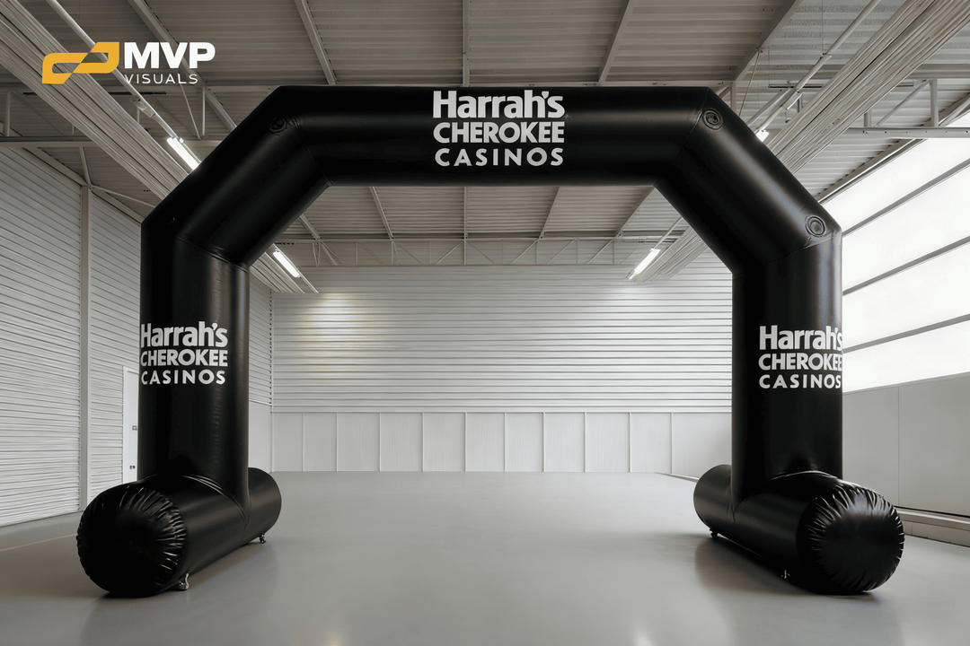 Black inflatable arch with Harrah’s Cherokee Casinos branding in indoor setting