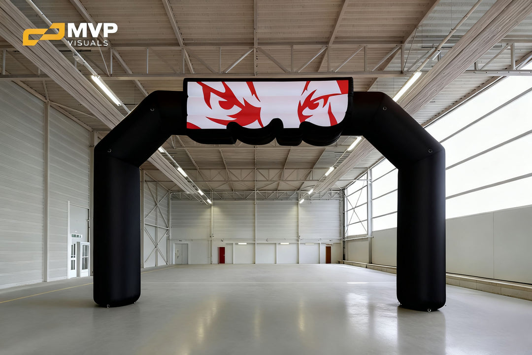Black inflatable arch with red eye graphics on topper panel