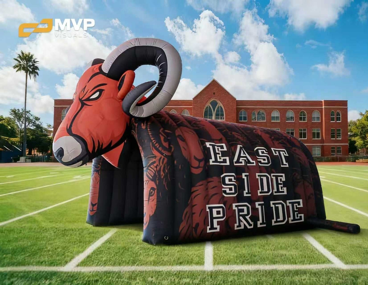 Inflatable ram sculpture with 'East Side Pride' text on a sports field, branded with MVP.