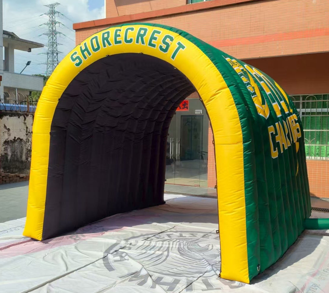 Rear view of inflatable tunnel with "Shorecrest" in yellow text on black entryway
