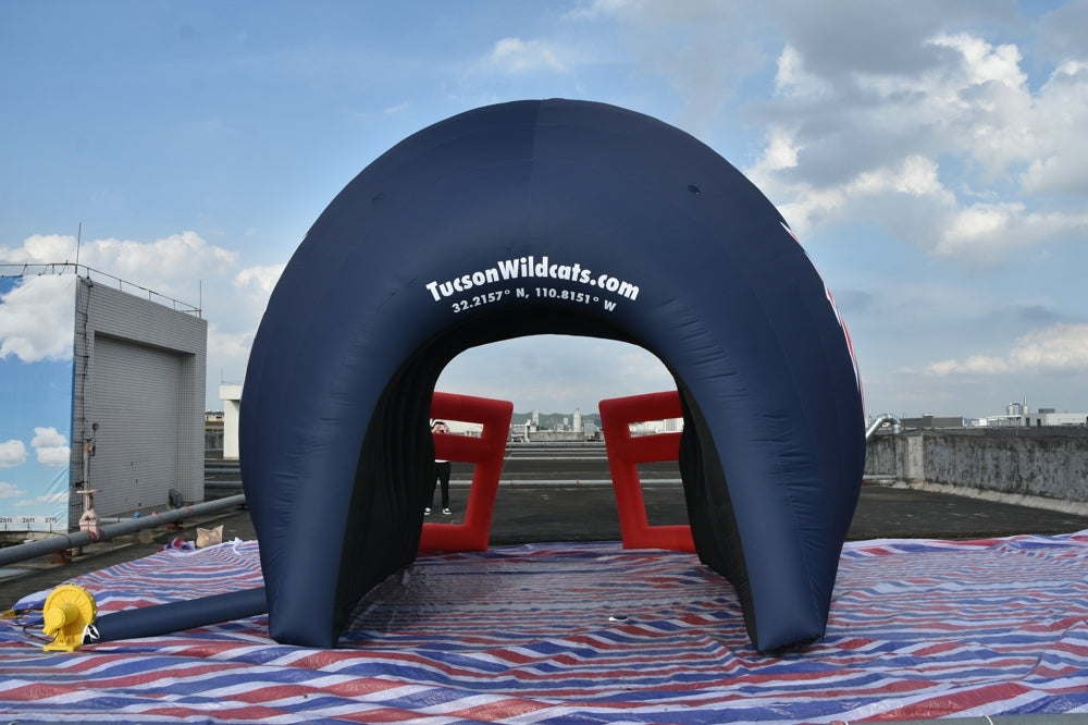Rear view of inflatable Wildcats tunnel with TucsonWildcats.com and coordinates