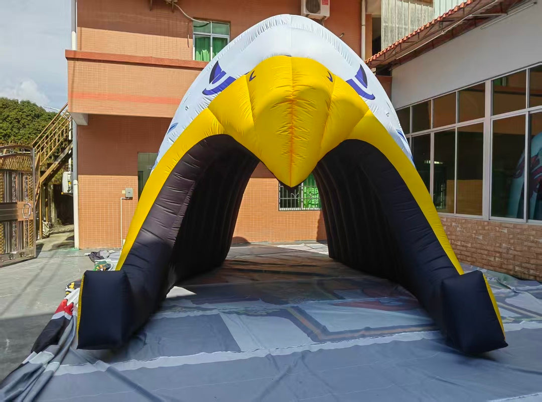 inflatable eagle head tunnel with yellow beak and black interior