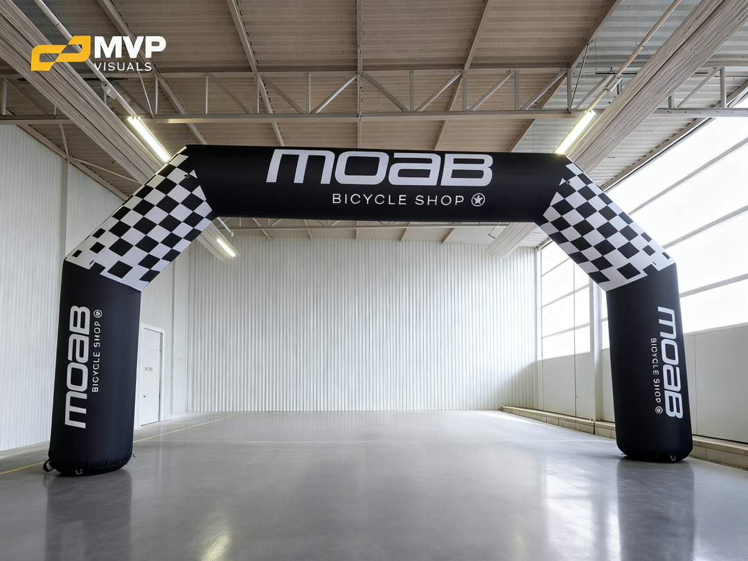 Moab Bicycle Shop inflatable arch with checkered flag pattern in modern warehouse