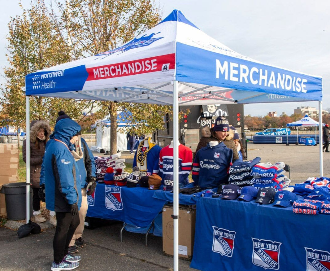 New York Rangers branded canopy tent for merchandise sales at outdoor winter event with team apparel display