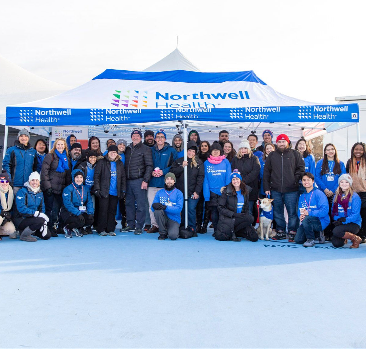 Northwell Health team under blue and white event tent