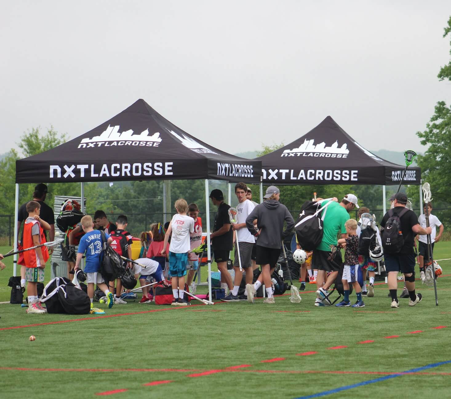 NXT Lacrosse custom canopy tent sports camp field setup