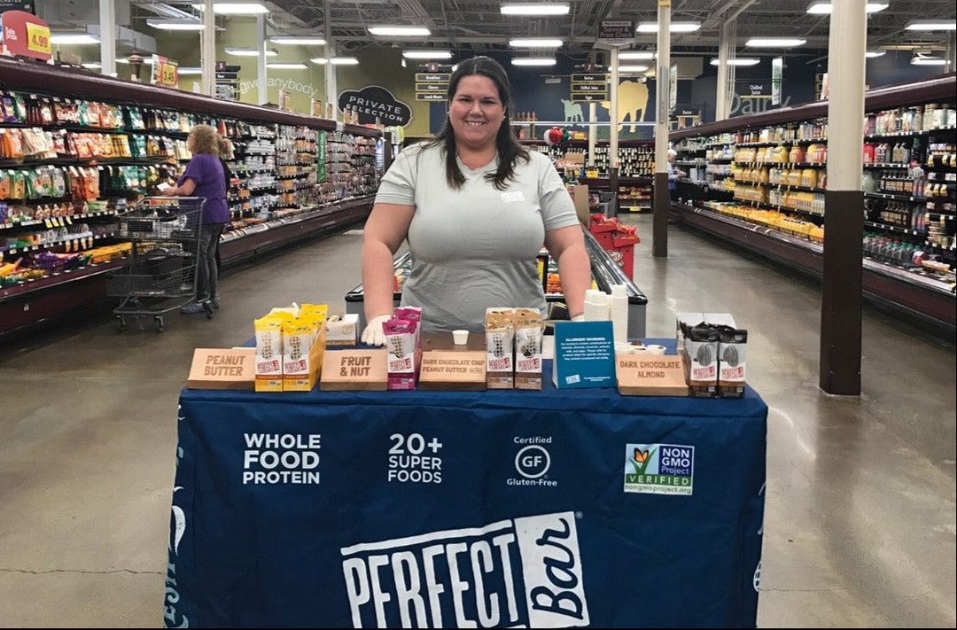 Perfect Bar branded table cover at Fred Meyer Seattle grocery store product sampling display