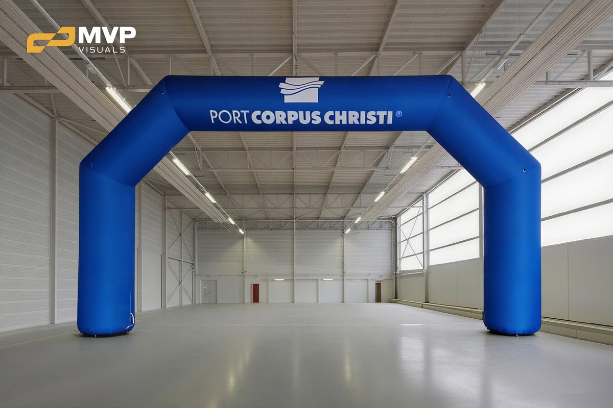 Large custom blue inflatable arch with Port Corpus Christi branding for outdoor event entrance, race start line, or promotional activation display
