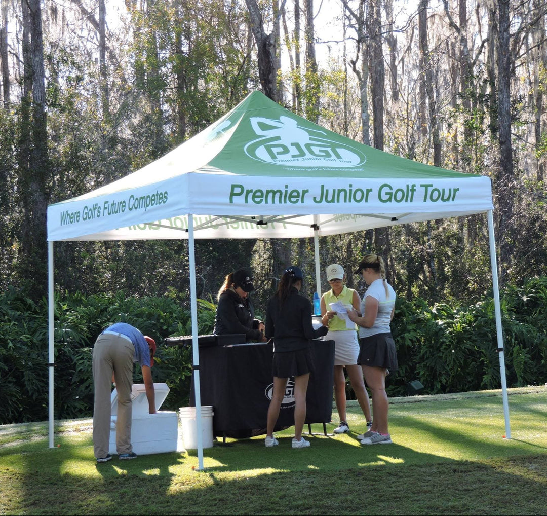 Premier Junior Golf Tour custom canopy tent at youth golf tournament check-in area on course