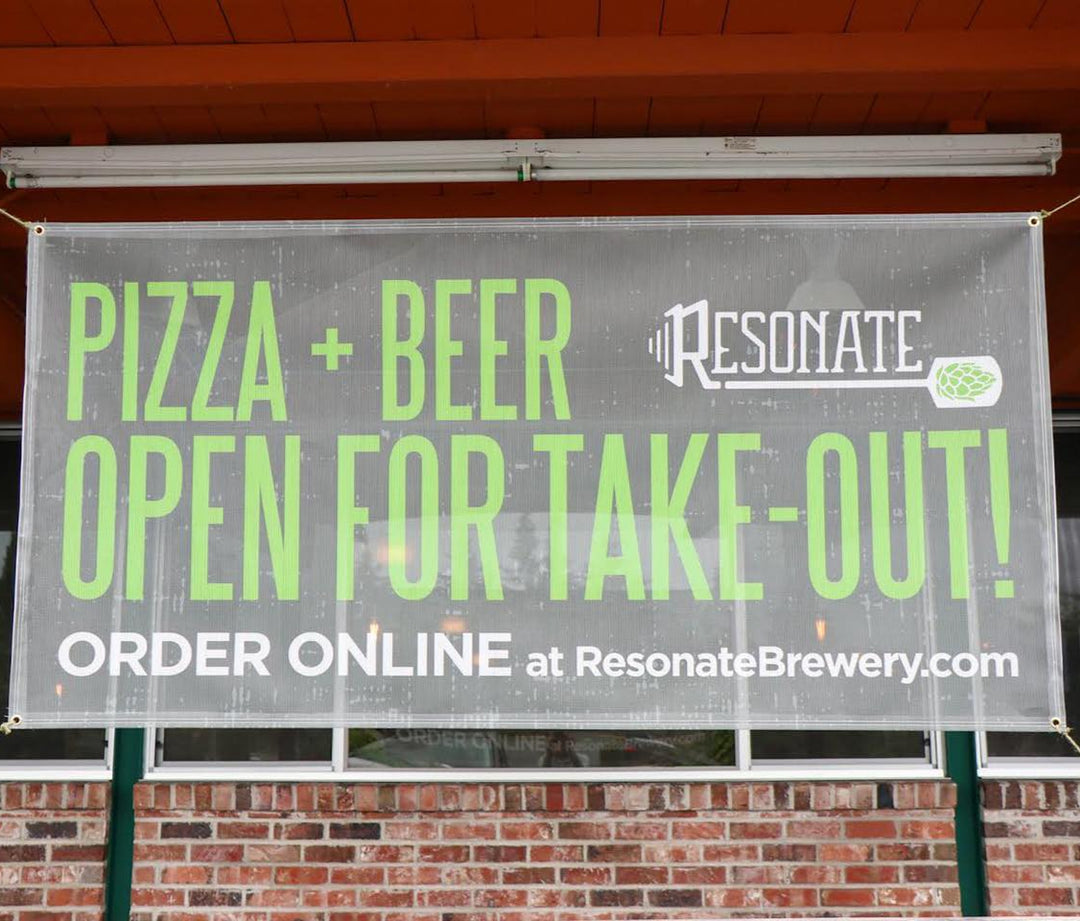 Resonate Brewery vinyl mesh banner advertising pizza and beer take-out service