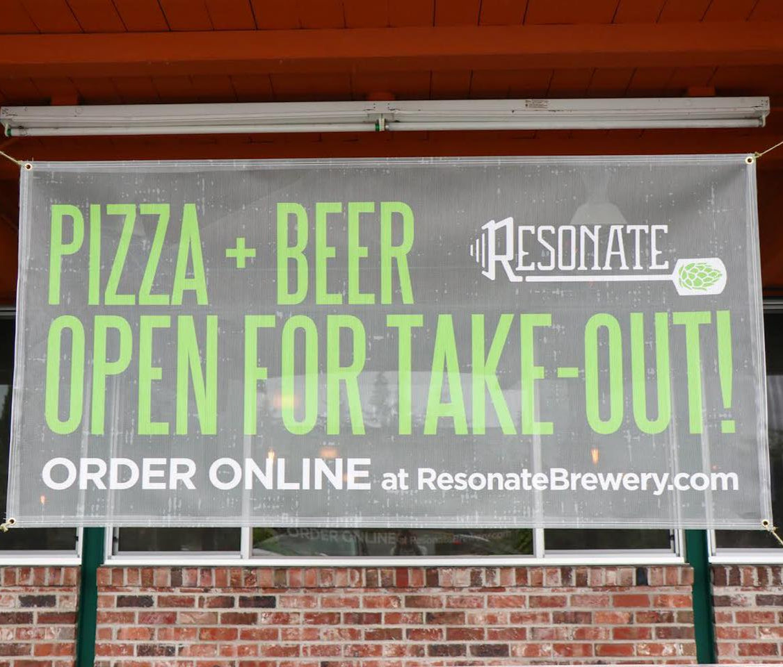 Resonate Brewery vinyl mesh banner advertising pizza and beer take-out service