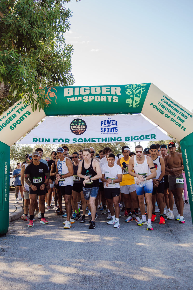 Bigger Than Sports inflatable start line runners ready at race start